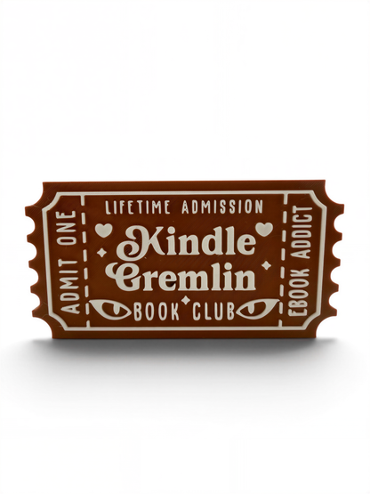 The image is a brown ticket-shaped object with white text, advertising a Kindle Cremlin Book Club.