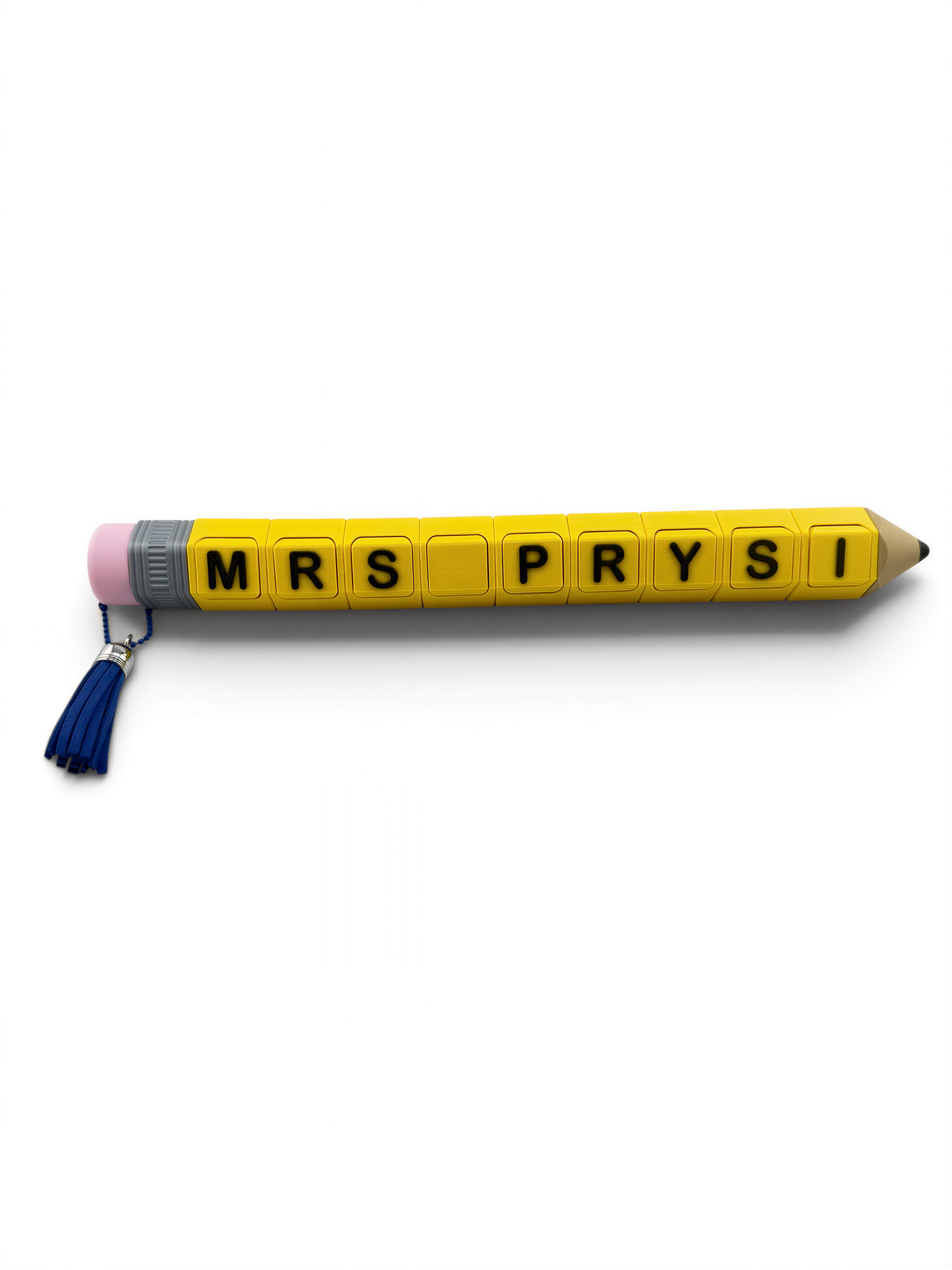 A yellow pencil with the name "MRS PRYSI" written on it in black letters.