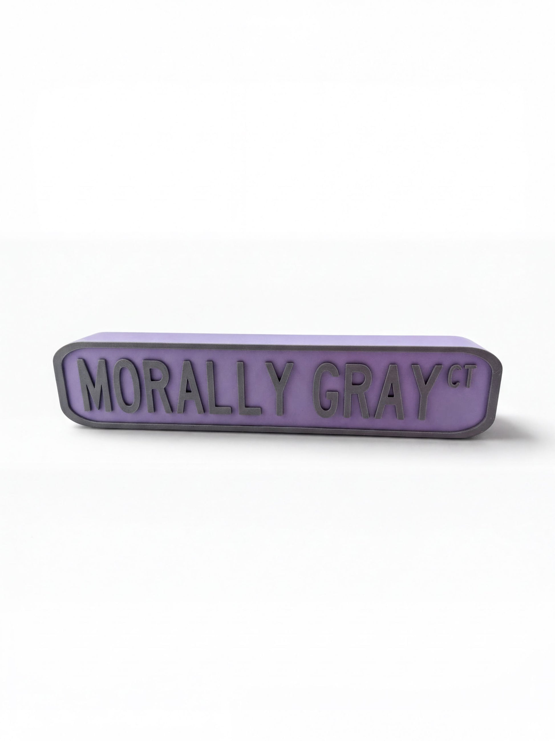 A purple rectangular sign with the text "Morally Gray" on it.