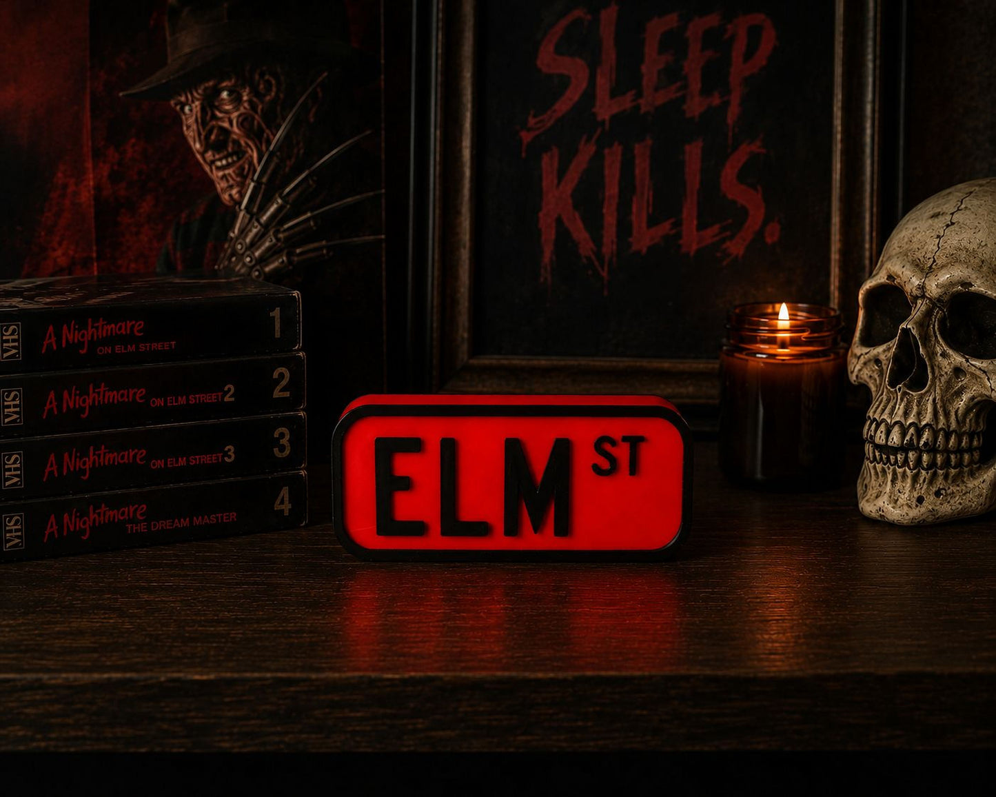 a collection of horror movie posters and memorabilia, including a skull, a red sign with the letters "ELM ST", and a stack of horror movie DVDs.