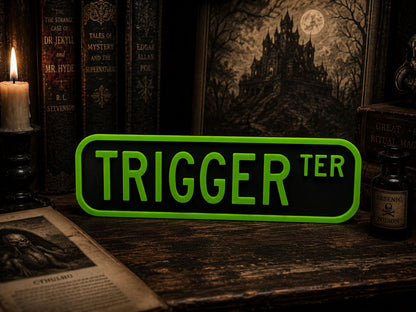 a sign that says "TRIGGER TER" in green letters, surrounded by various books, a candle, and a bottle of what appears to be a mysterious liquid.