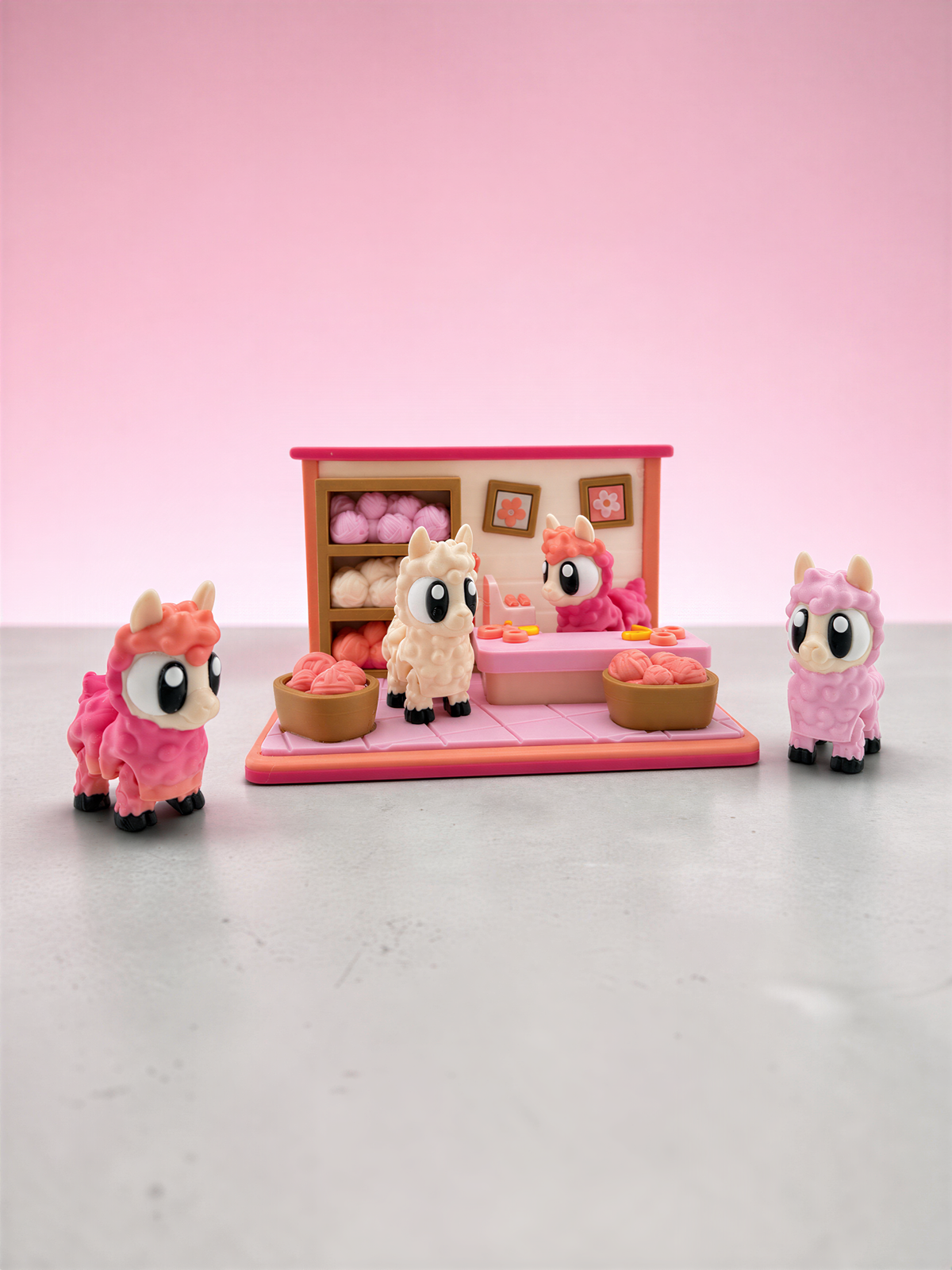 A pink toy shop with three small toy animals, including a pink llama, a pink cat, and a pink dog, arranged on a pink background.