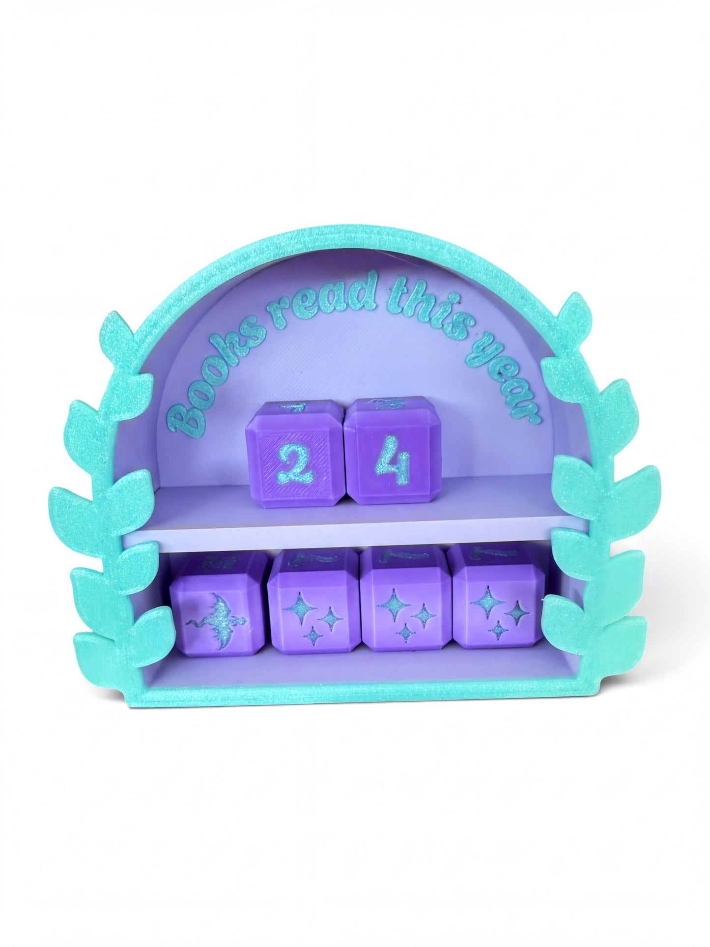 A purple and teal wooden shelf with purple cubes on it, displaying the text "Books read this year" and a number "24" on the cubes.