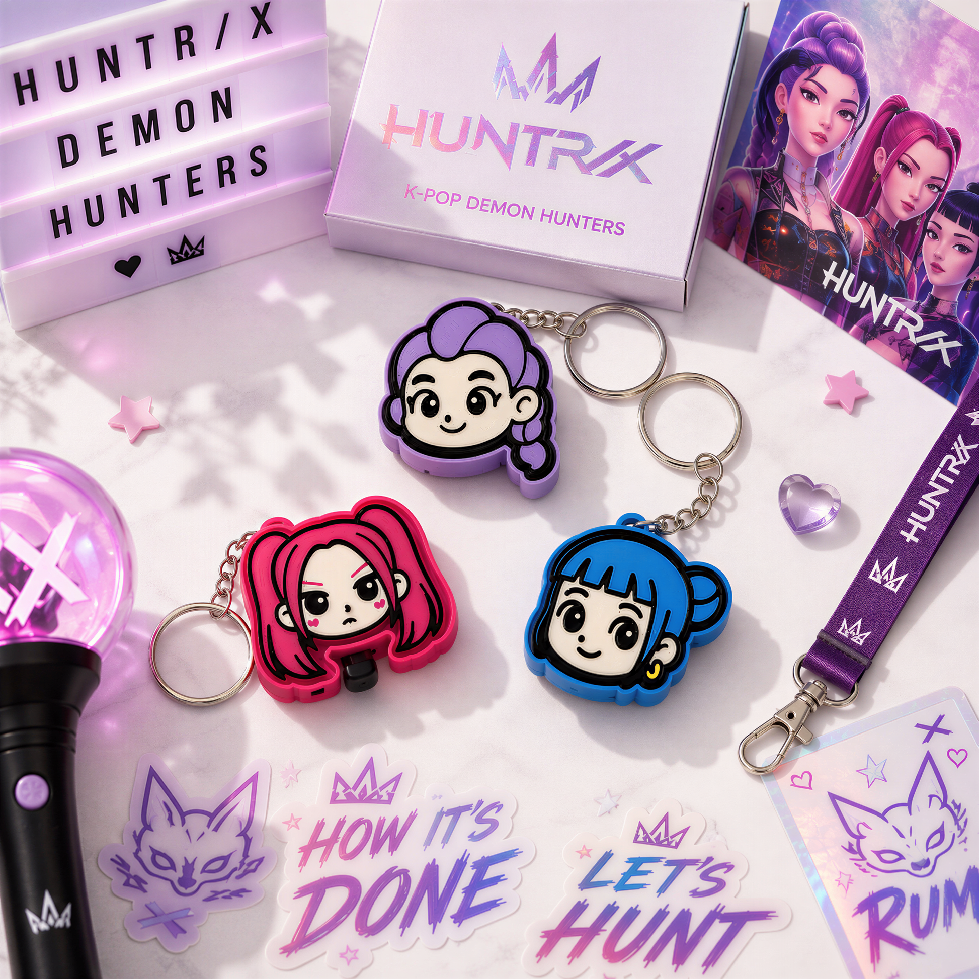 various items related to the K-pop group HUNTRX, including keychains, stickers, and a lanyard.