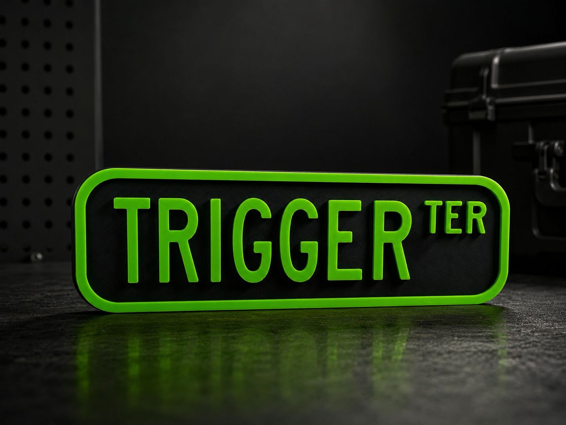 A green rectangular sign with the word "TRIGGER" in large, bold letters.
