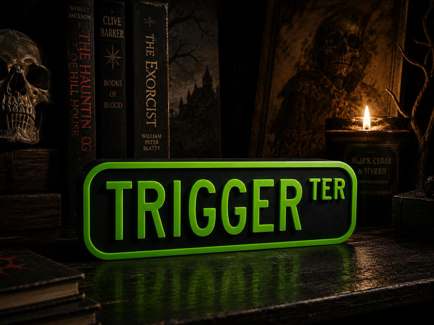a green sign with the word "TRIGGER" in large letters, surrounded by various spooky and eerie elements such as a skull, a candle, and books.