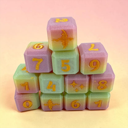 A stack of colorful dice with numbers and symbols on them.