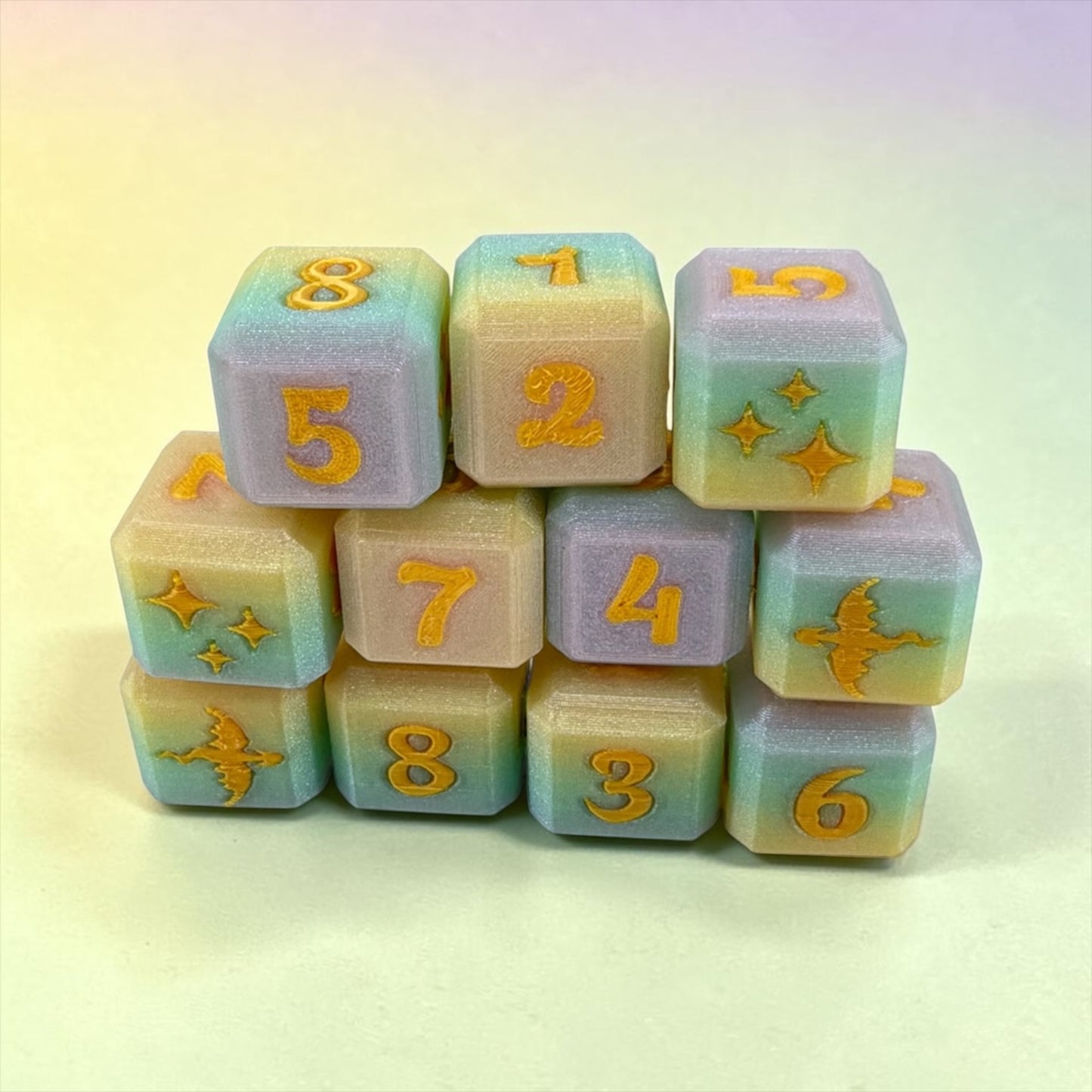 A stack of colorful dice with numbers and various designs on them.