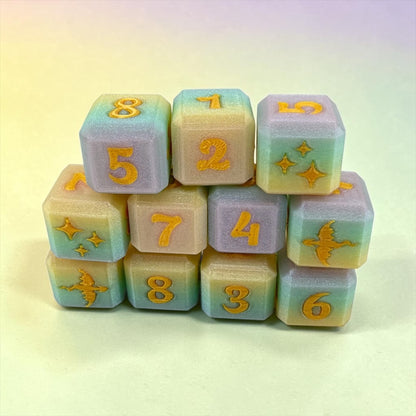 A stack of colorful dice with numbers and various designs on them.