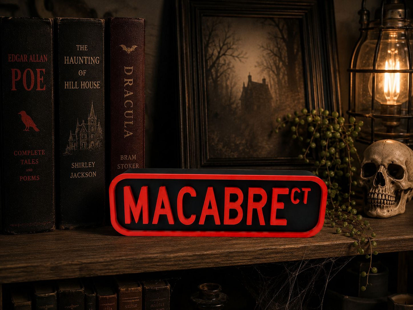 a bookshelf with various books, a skull, and a lantern. The bookshelf has a sign that says "MACABRECT" in red letters.