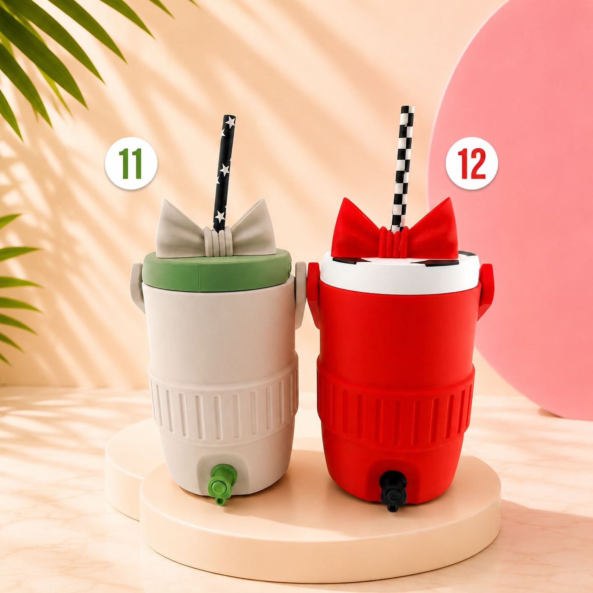 Two colorful drink containers with straws, one white and one red, are placed on a white pedestal against a pink background.