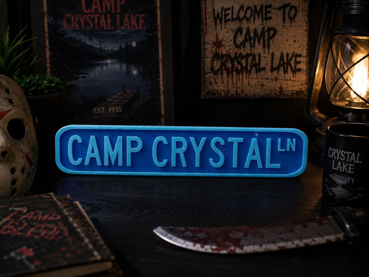 a sign that reads "CAMP CRYSTAL LN", surrounded by various items related to the horror movie "Camp Crystal Lake".